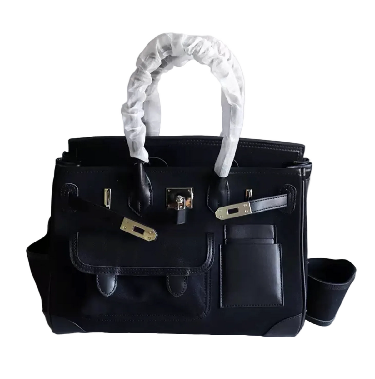 Black handbag with white handle on a light gray background