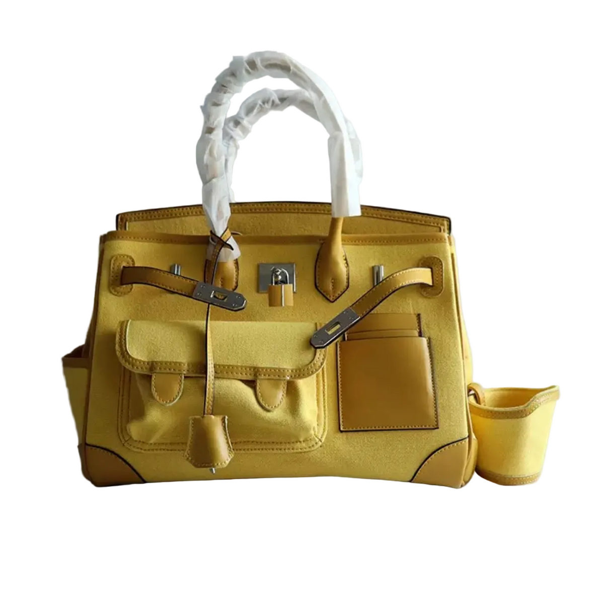 Yellow handbag with white handle on a light gray background