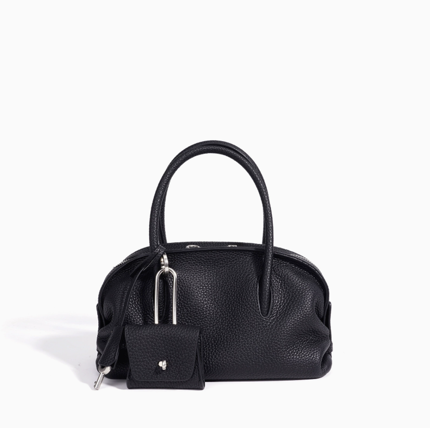 Black handbag with a matching pouch on a white background
