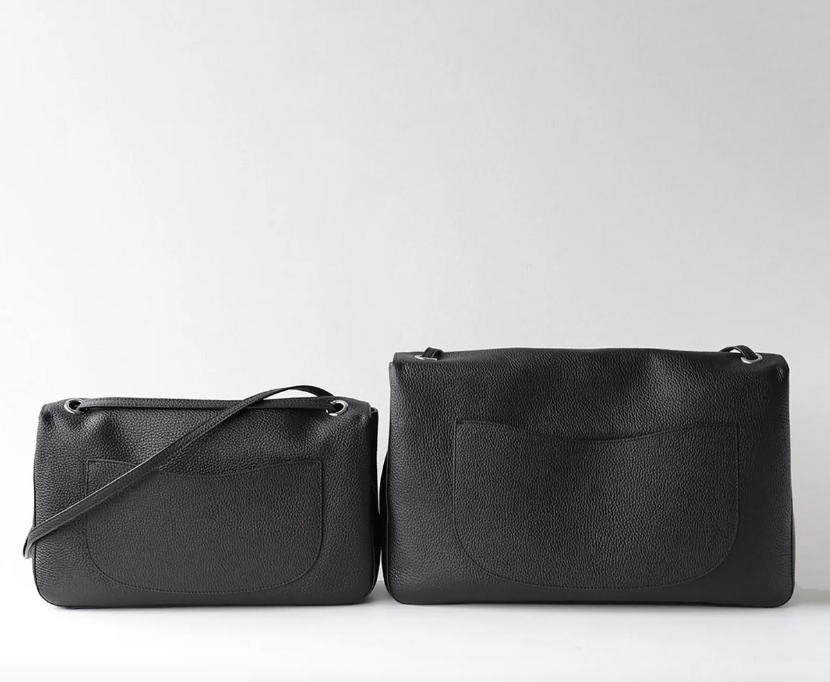 Interior of the Venebag Turn-Lock Crossbody showing zip, slot, and phone pockets