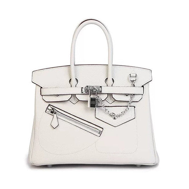 A structured white leather handbag with silver-tone hardware, featuring a top handle, front strap closure, and a zippered front pocket, photographed on a clean white background.