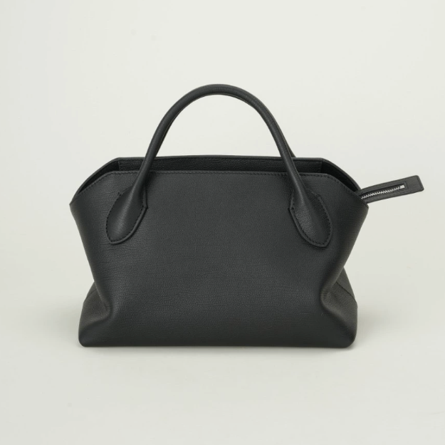 Black handbag on a light gray background