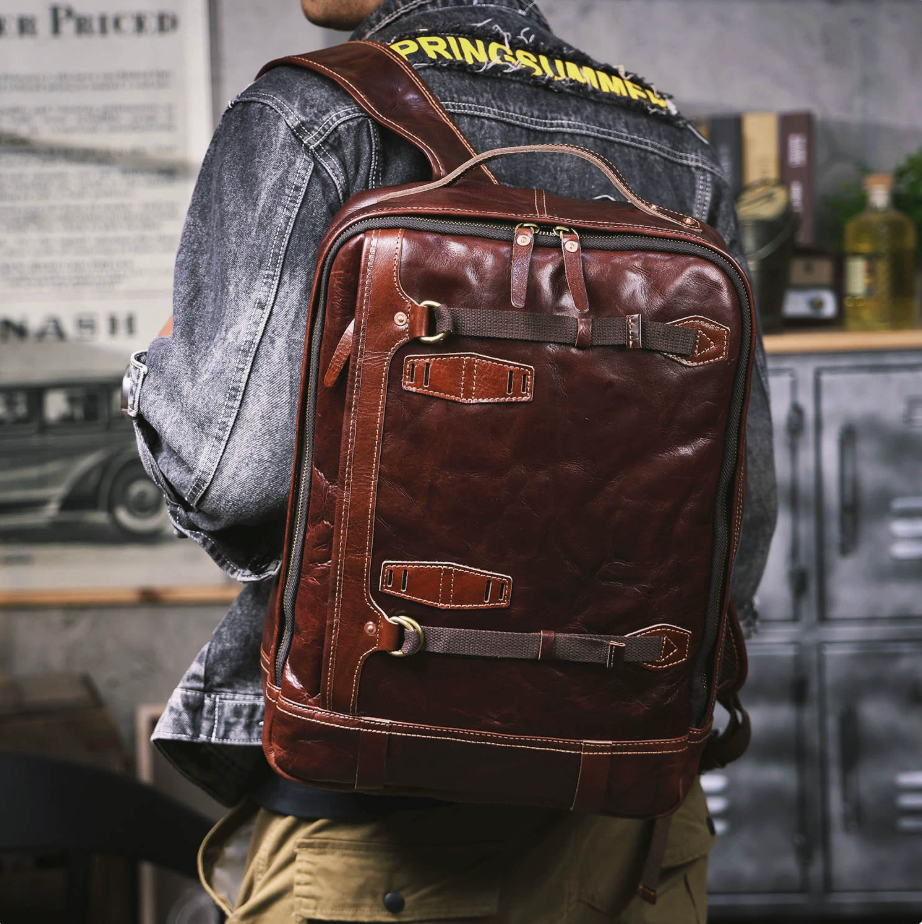 Brown leather backpack worn by a person in an urban setting