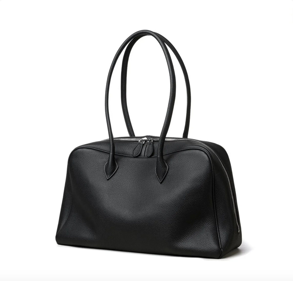 A black pebbled leather handbag with dual top handles and a zippered closure, photographed on a clean white background.