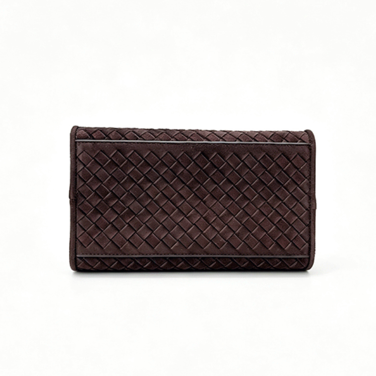 A dark brown woven leather clutch or wallet with a structured rectangular shape, shown against a plain white background.
