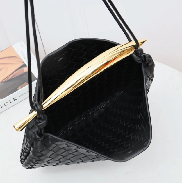 Medium leather bag with golden top