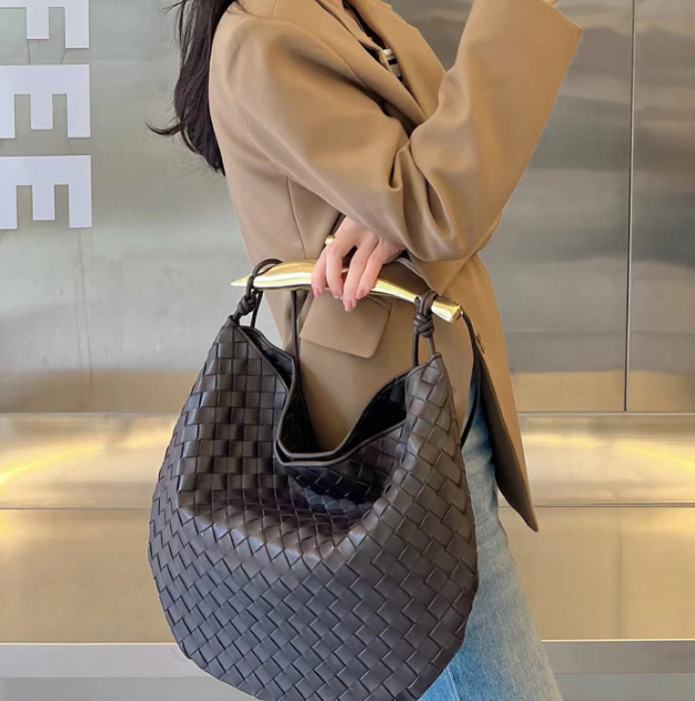 Medium leather bag with golden top