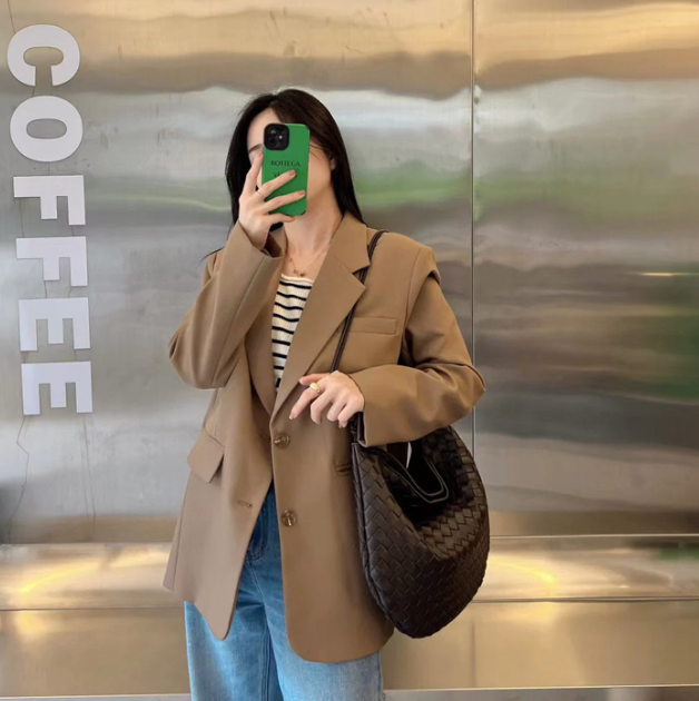 Medium leather bag with golden top