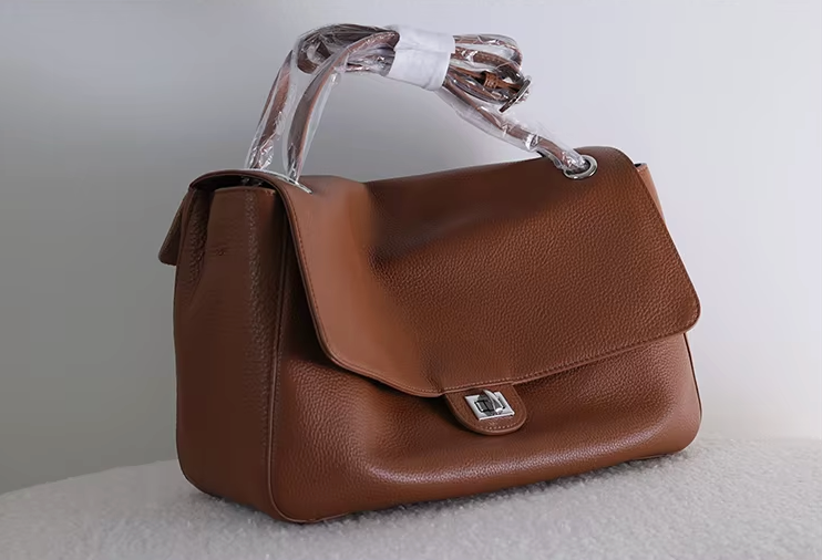 Interior of the Venebag Turn-Lock Crossbody showing zip, slot, and phone pockets