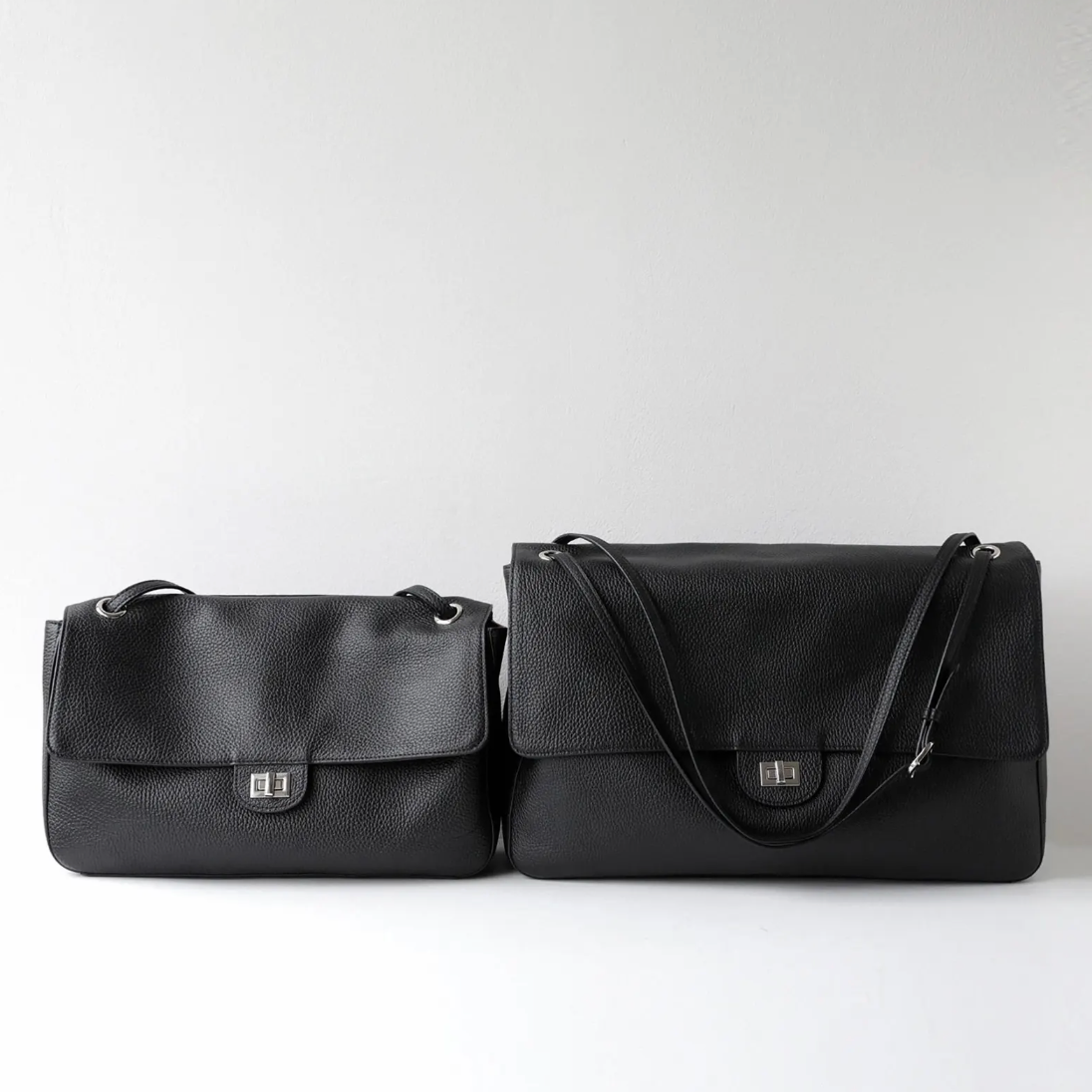 Close-up of the turn-lock closure on Venebag's Turn-Lock Crossbody leather bag