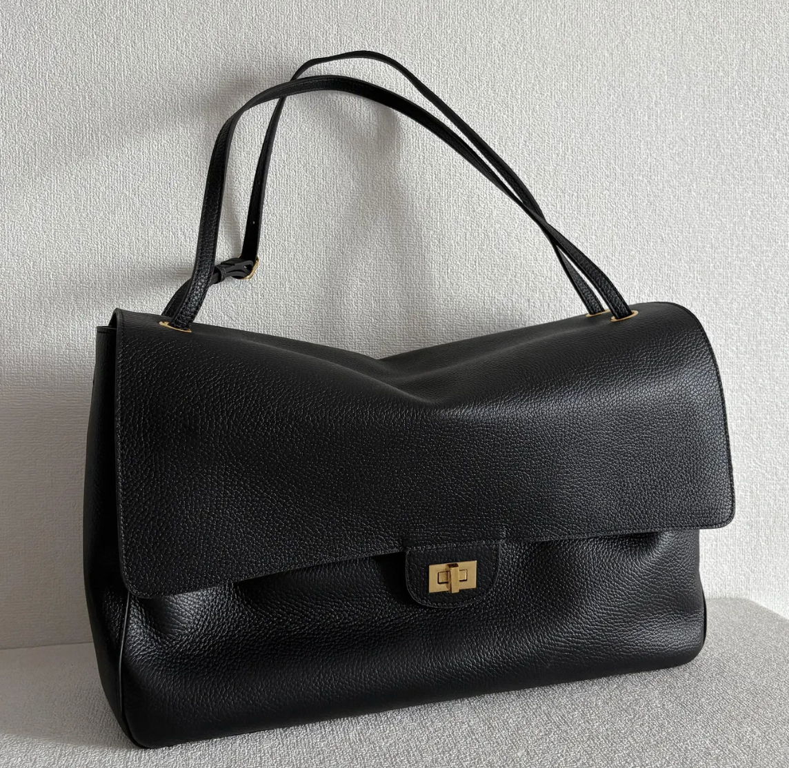 Interior of the Venebag Turn-Lock Crossbody showing zip, slot, and phone pockets