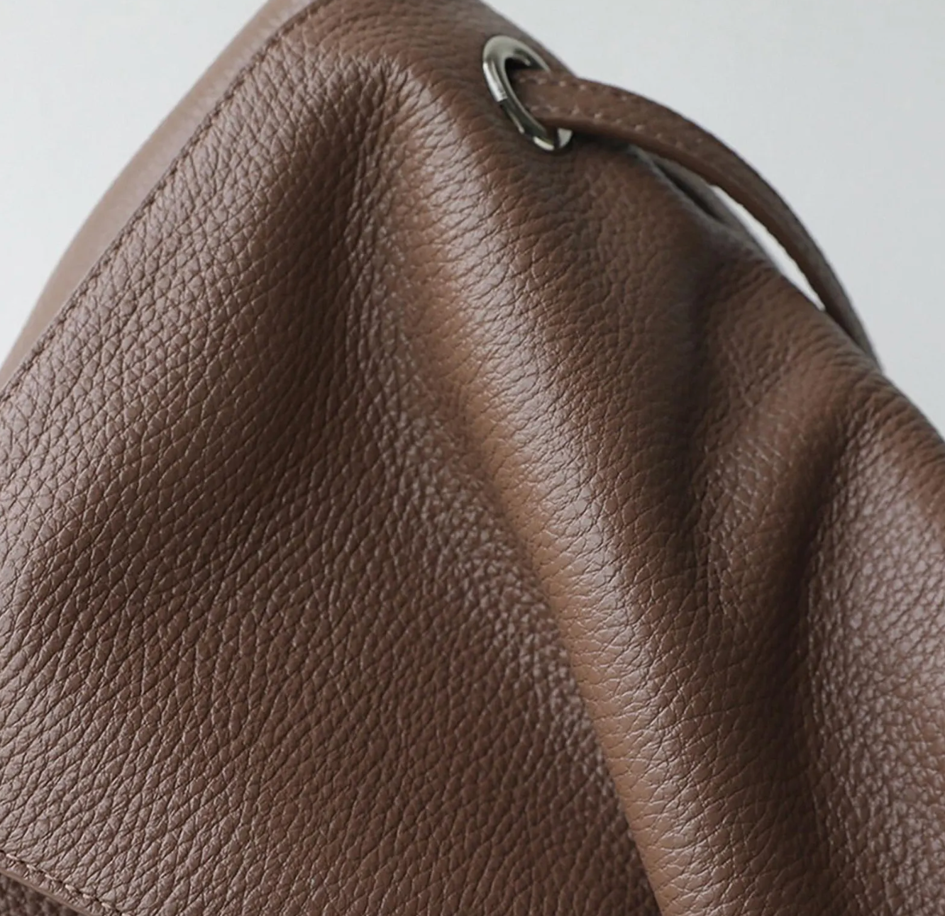 The Venebag Turn-Lock Crossbody styled as an everyday crossbody bag